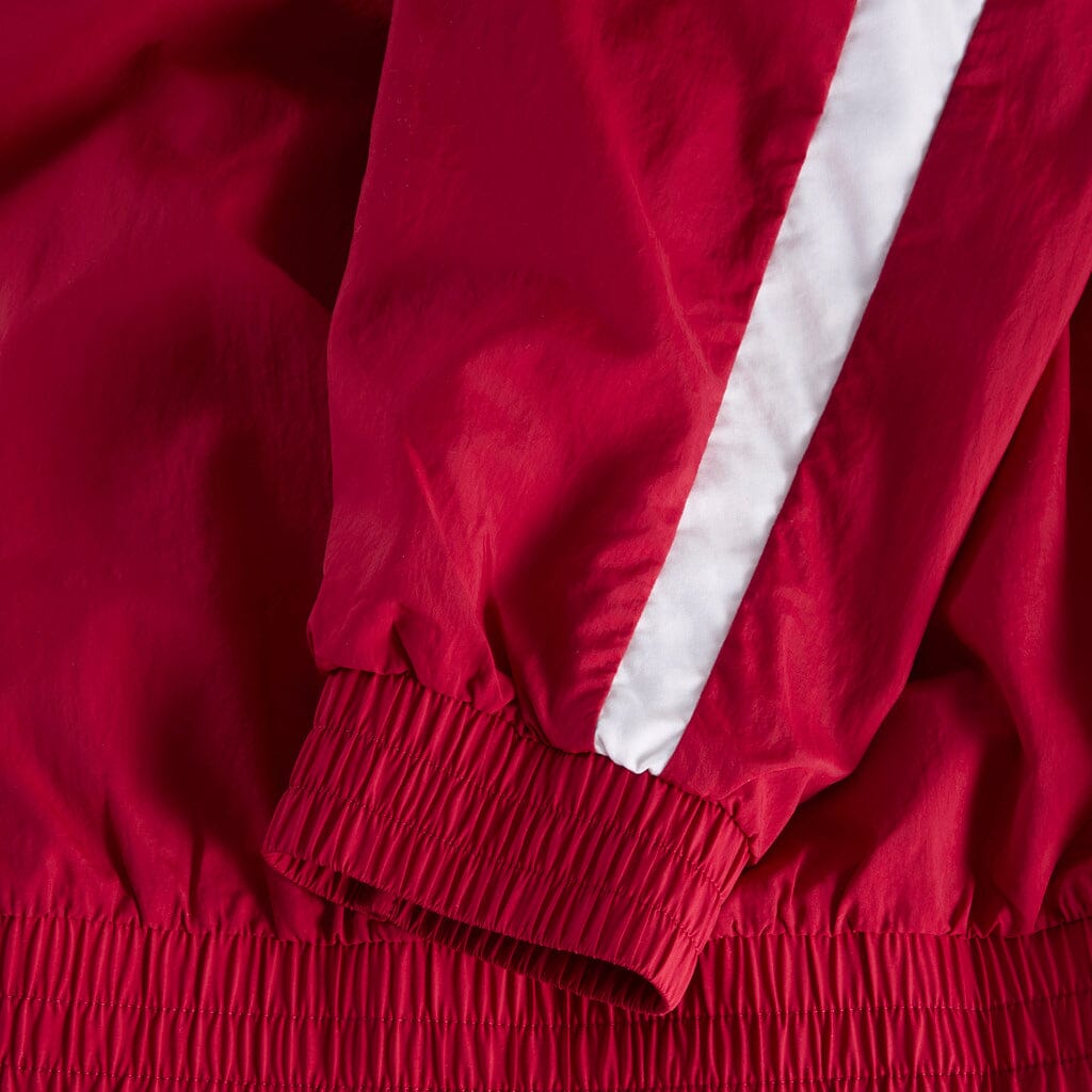 Dark cherry track jacket cuffs and hem with elastic cinch and white stripe accents