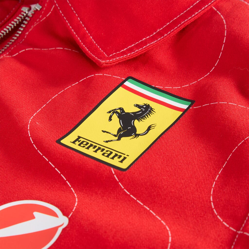 Ferrari shield patch on red team jacket fabric