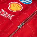 Red jacket zip with Shell sponsor graphic and stitched seams