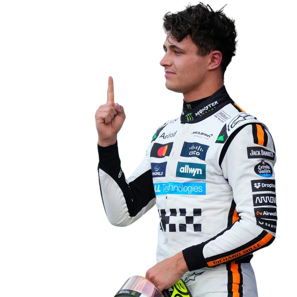 2025 McLaren F1 Monaco GP race suit replica on a racing driver in white orange suit holding helmet and pointing upward