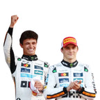 Two drivers in white race suits and caps showcasing Oscar Piastri Monaco race suit replica details