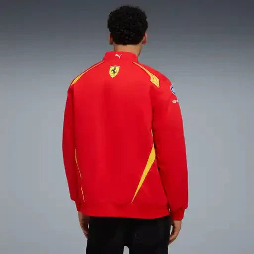 Red zip-up team jacket on model from back, Ferrari shield with yellow accents