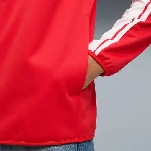Red softshell jacket sleeve with white stripe trim and zip cuff detail